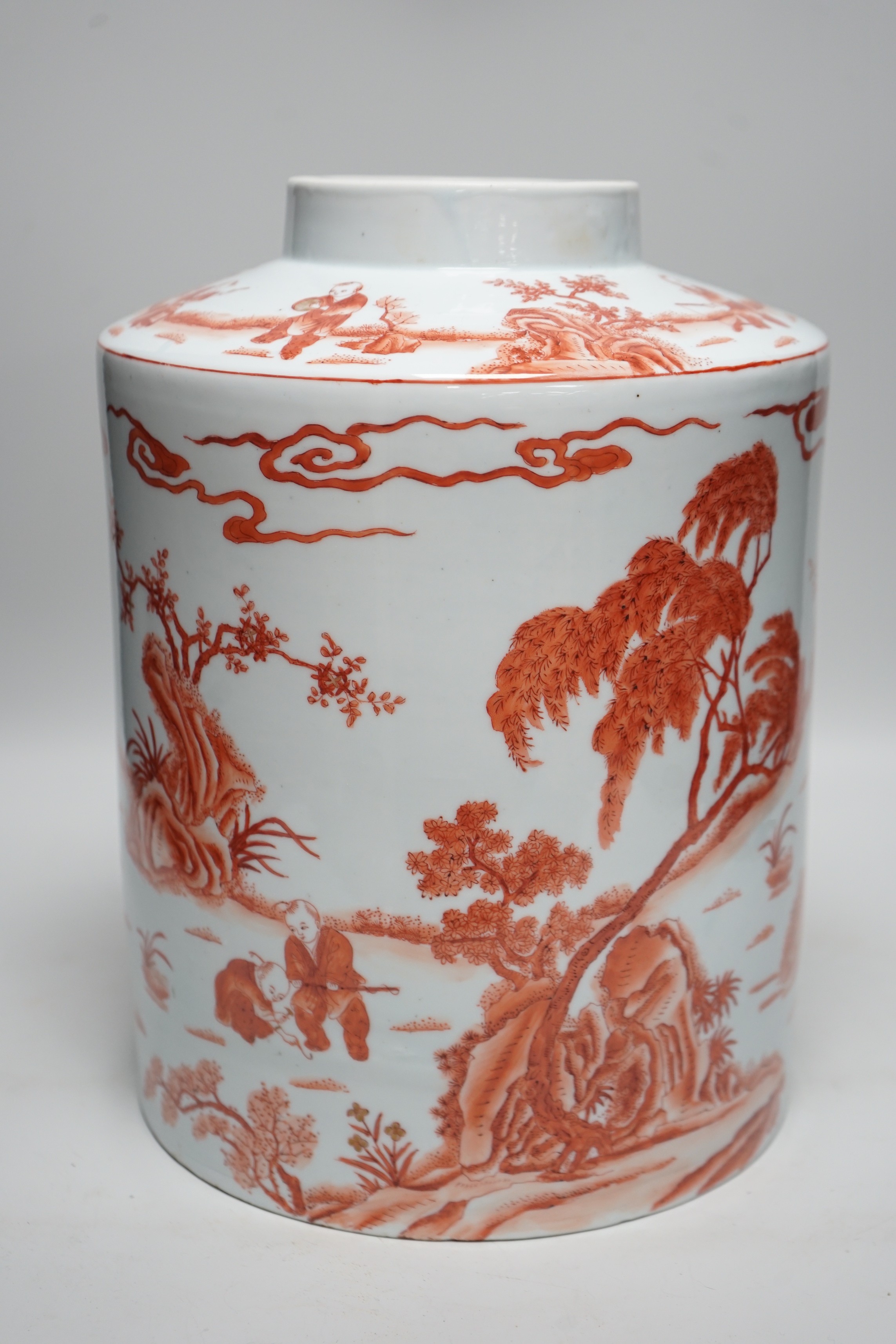 An early 20th century copper red enamelled canister. 30cm tall